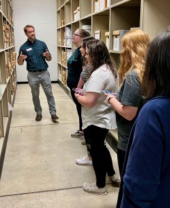 Brandon Thompson gives a student tour of UA Museums' Collections.