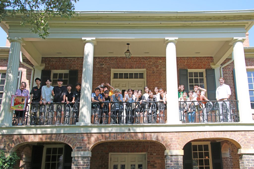 a group of Japanese students from Chiba University touring the Gorgas House Museum