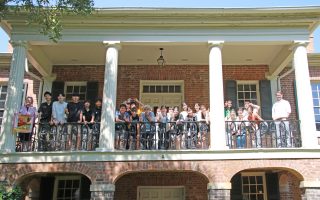 a group of Japanese students from Chiba University touring the Gorgas House Museum